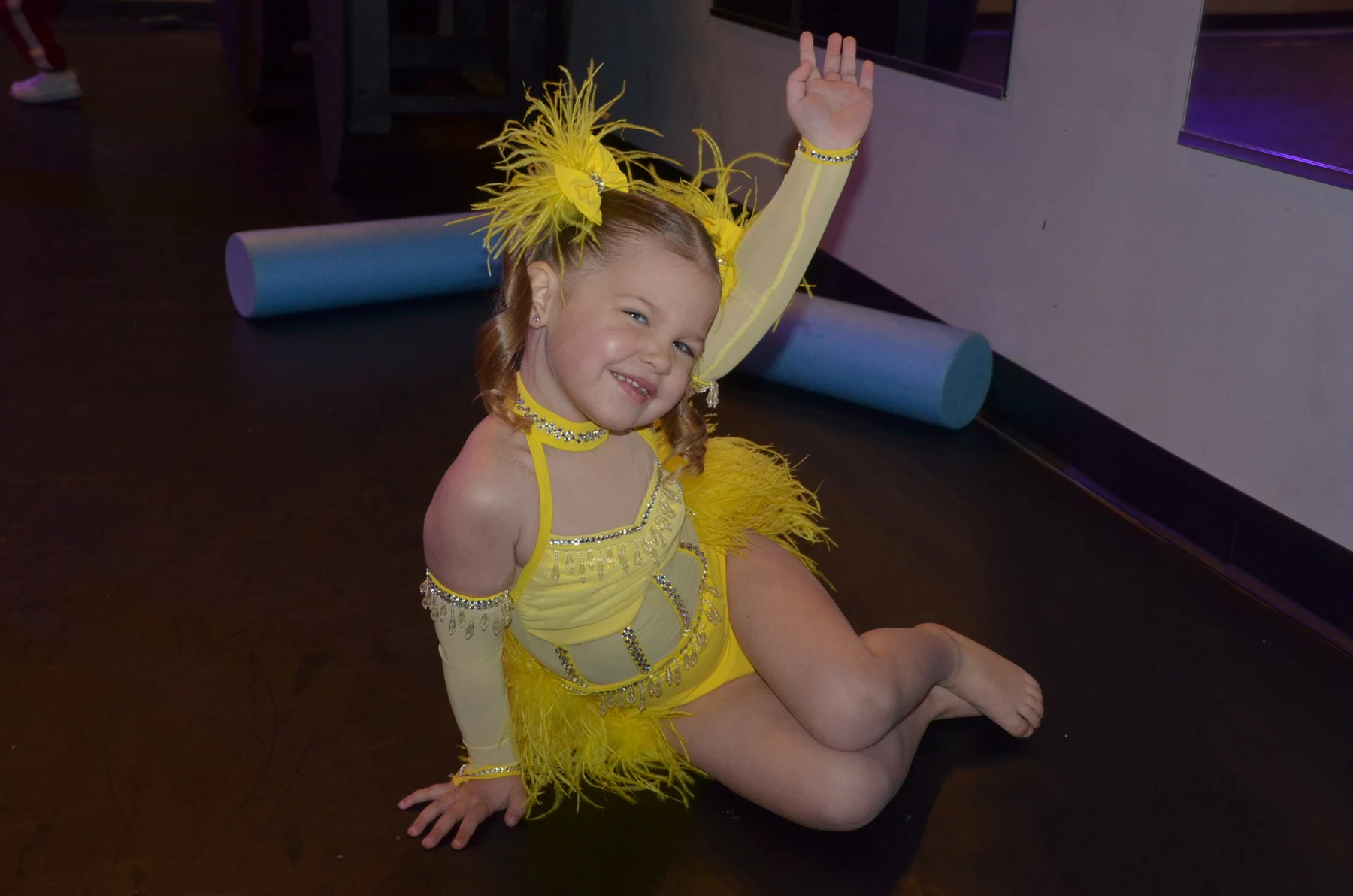 Young dancer in yellow costume