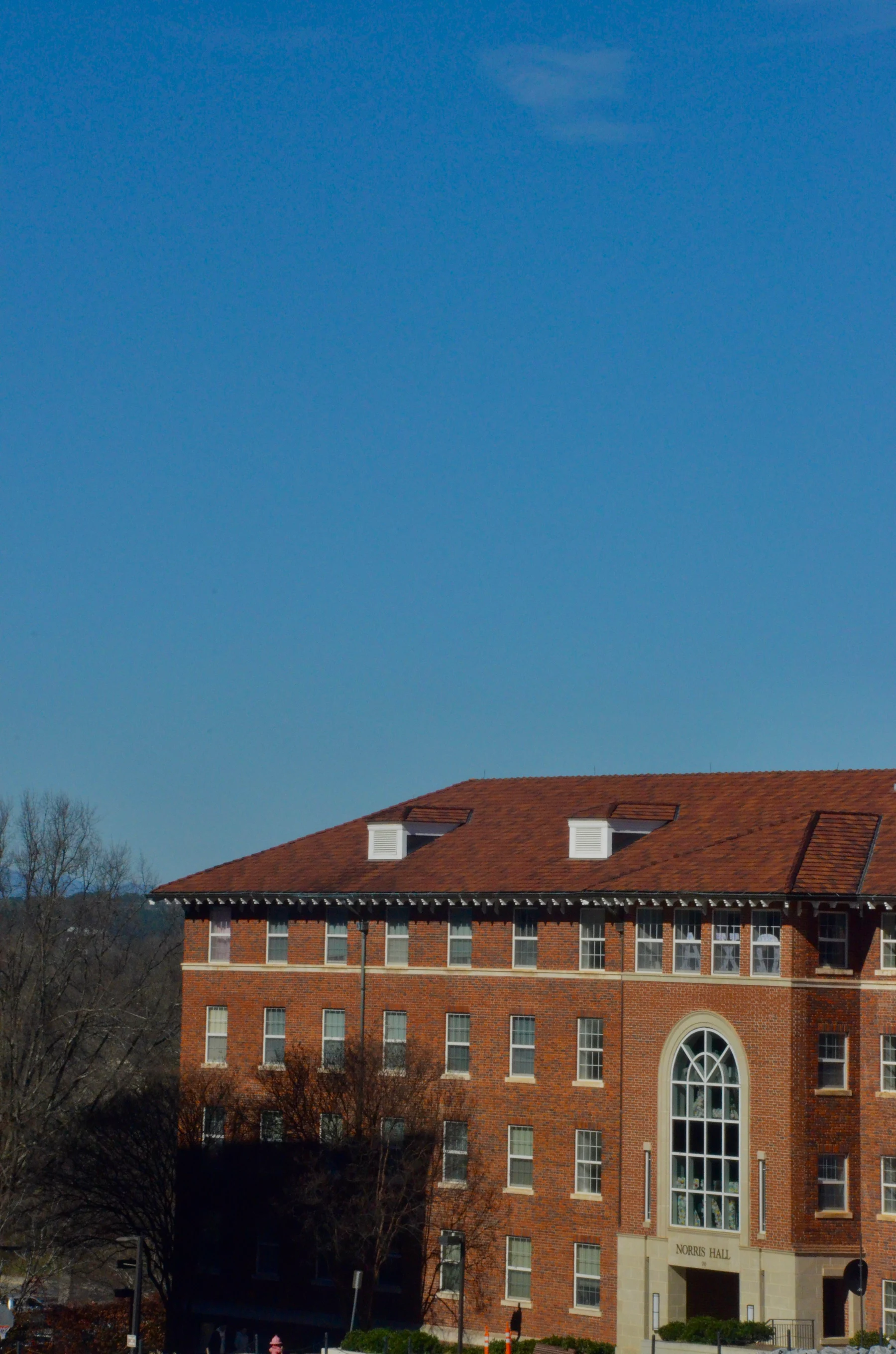 Campus building under a blue sky