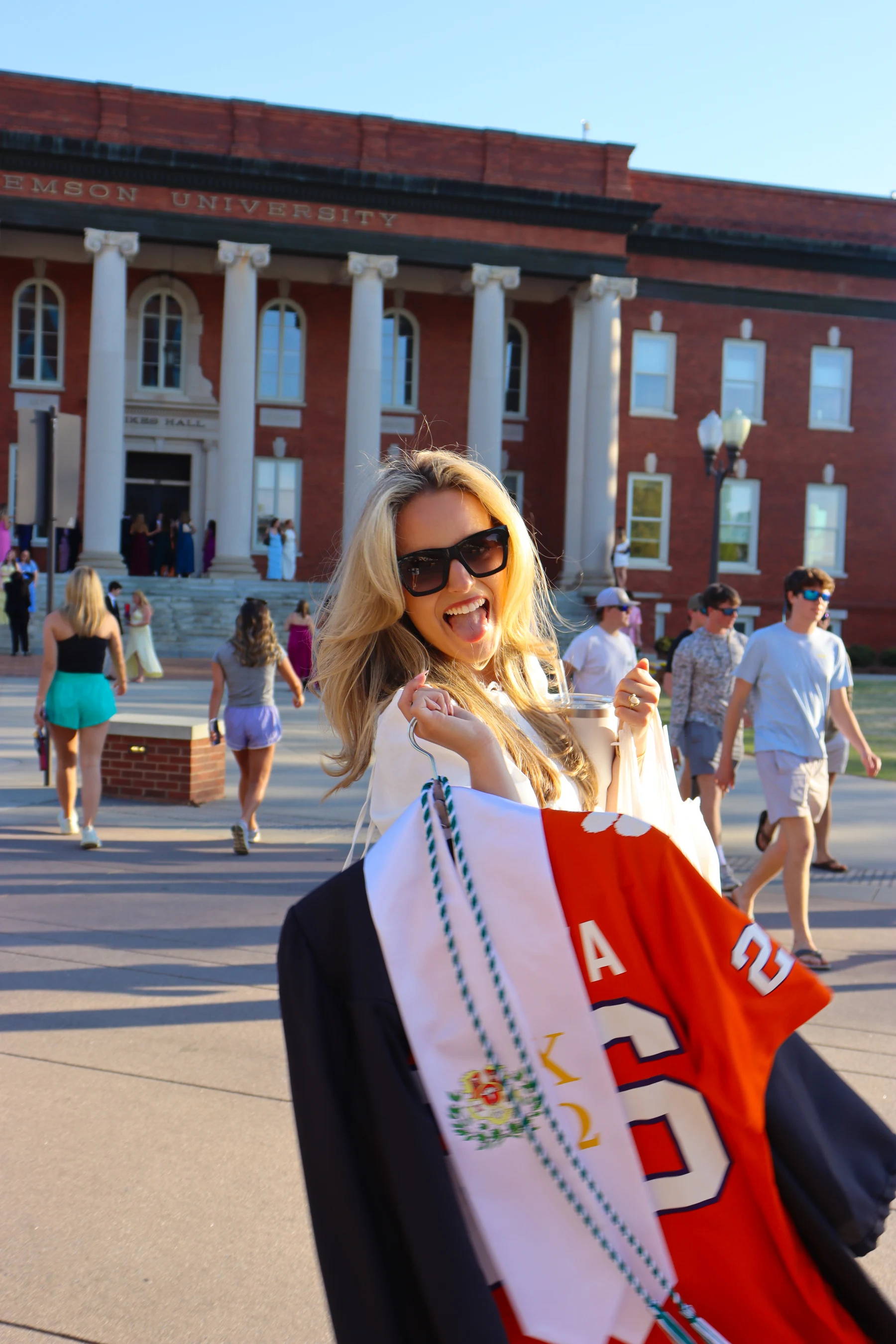 Graduate holding a Clemson stole